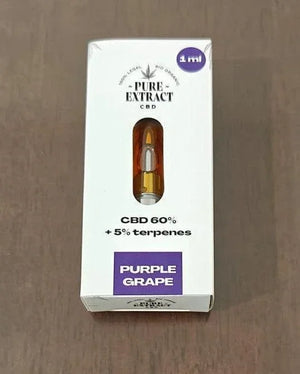CBD cartridge packaging labeled Purple Grape, 1ml, 60% CBD, 5% terpenes on wood surface