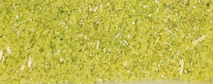 Closeup of blended dried herbs for herbal smoke blend, green and yellow plant mix