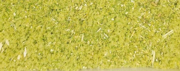 Closeup of blended dried herbs for herbal smoke blend, green and yellow plant mix