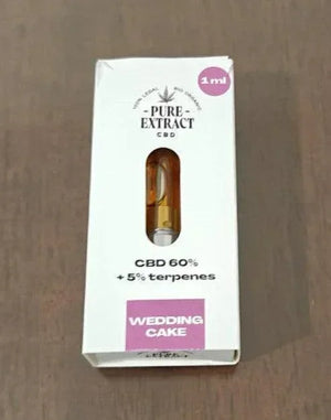 Close-up of 1ml CBD cartridge box labeled Wedding Cake, with 60% CBD and 5% terpenes