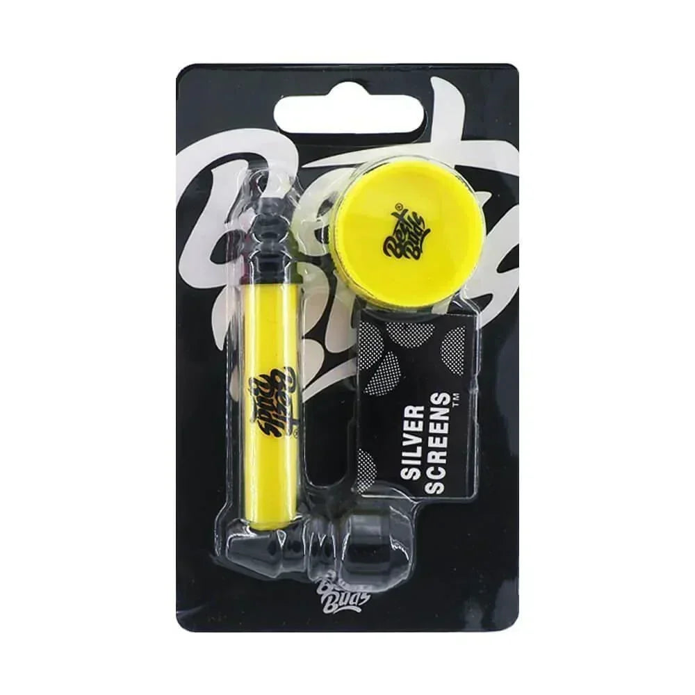 Yellow metal pipe with mini grinder and silver screens set for herbal use in retail packaging