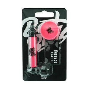 Pink metal pipe with mini grinder and silver screens in retail packaging, cannabis accessories.