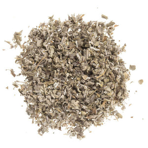 Dried sage leaves finely cut, loose and scattered on a white background.