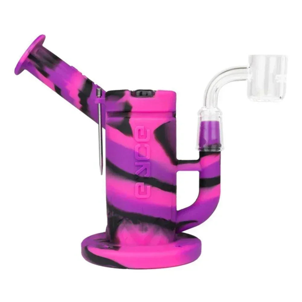 Colorful silicone dab rig with glass banger for herbal concentrates on white background