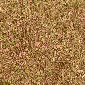 Close-up of a blended herbal mixture with green and purple plant material, ideal for wellness use.