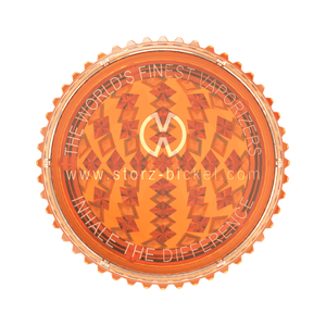 Transparent orange plastic herb grinder with serrated edges and geometric design