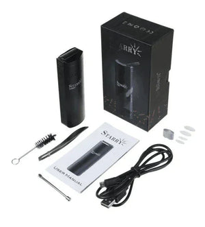 Portable dry herb vaporizer kit with accessories, USB cable, and user manual on white background