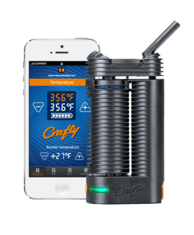 Storz & Bickel CRAFTY vaporizer beside a smartphone showing temperature controls.