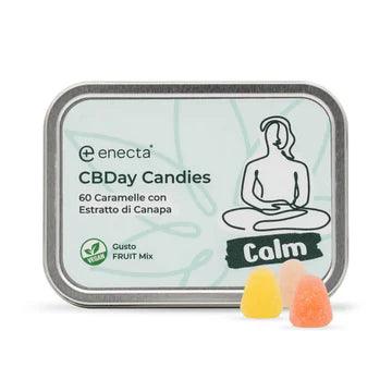 CBD gummies in tin box labeled CBDay Candies with fruit mix flavor, hemp extract, and vegan icons
