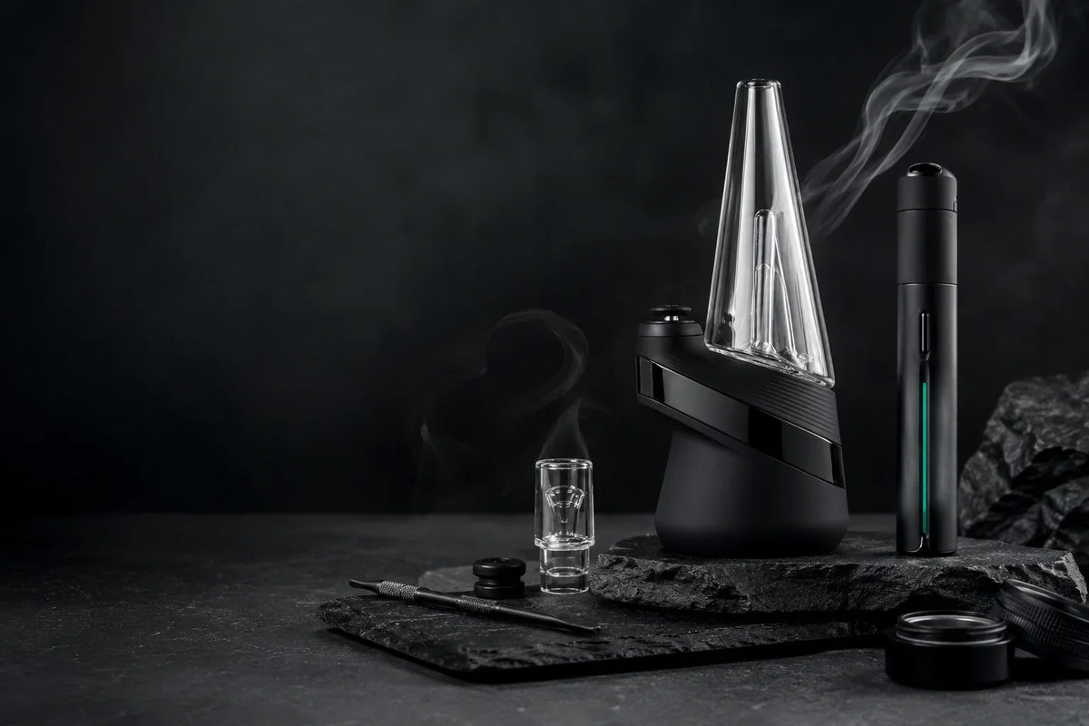 Premium Puffco concentrate vaporizers and accessories displayed on a dark stone surface