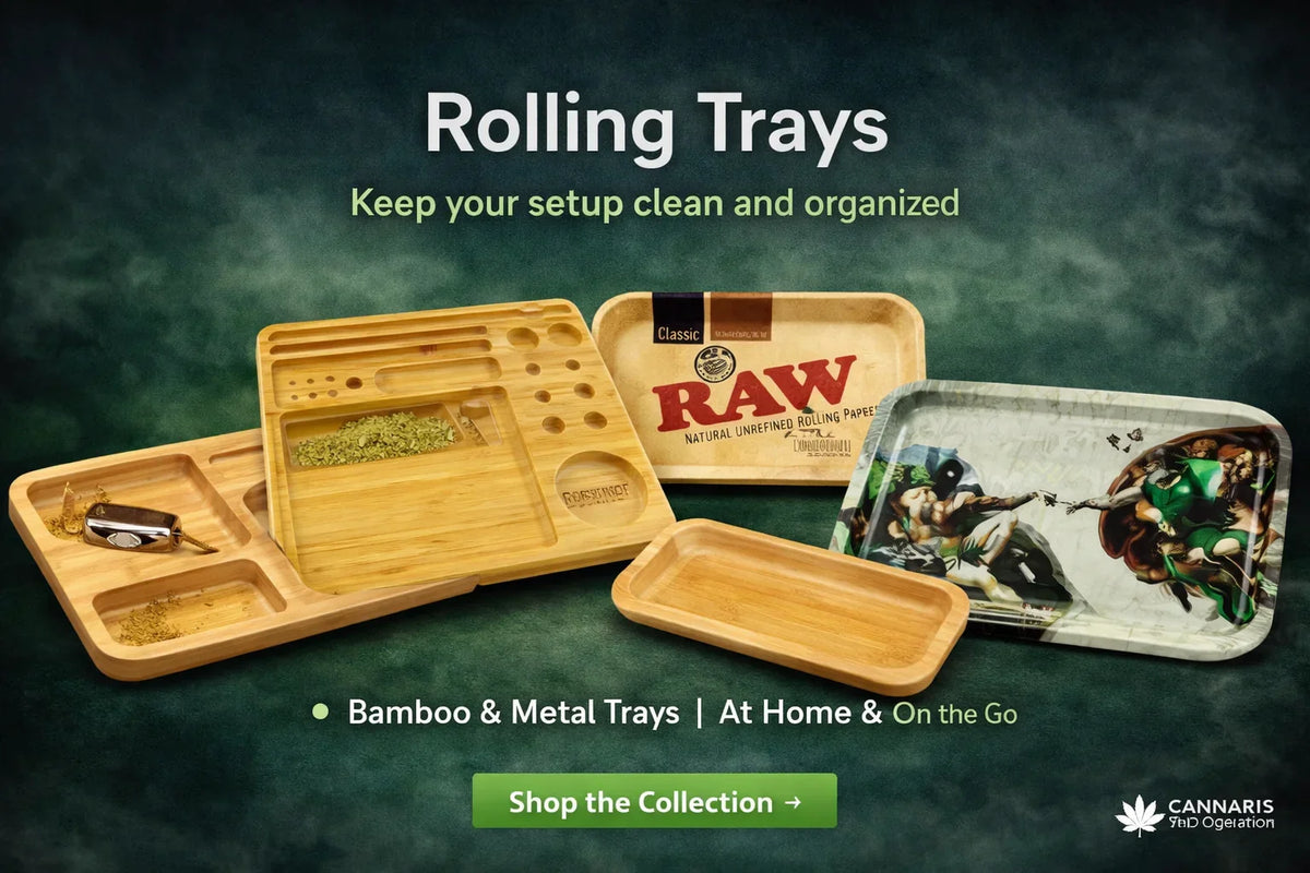 Assorted bamboo and metal rolling trays for herbs, including RAW and graphic print trays, on green background.