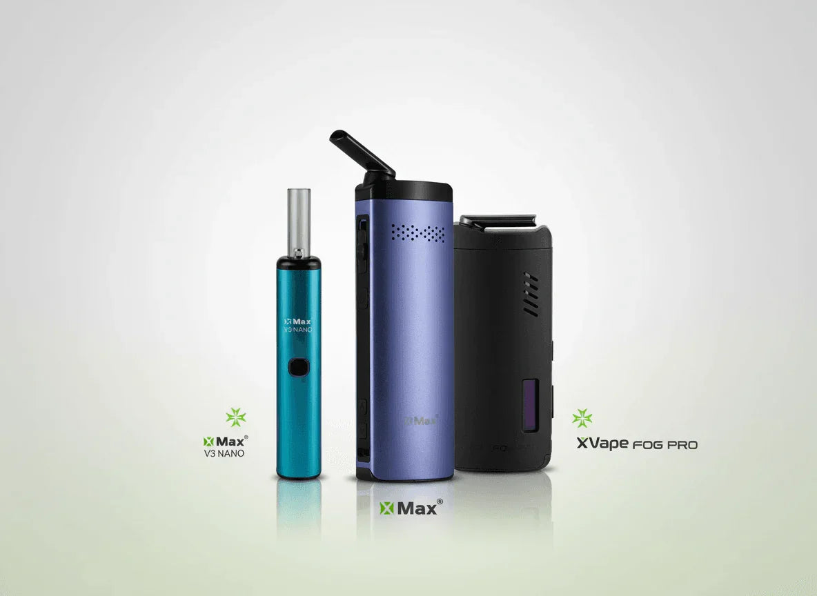 Assorted blue and black portable dry herb vaporizers on a white background.